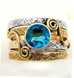 “New Song” ring blue topaz set in solid sterling silver with brass accents