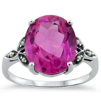 “Mine” Breathtaking 7 carat pink sapphire, (lab) set in solid Sterling silver with tiny seed pearl accents.