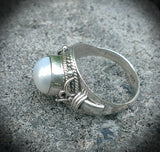 Ornate sterling silver button pearl ring.